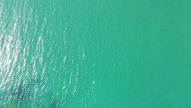Crystal clear water at Castiglioncello coast side near famous Bagno Salvadori. Aerial flying over water area cliff rock beaches. Sunny day, mid July summer. Tuscany Livorno Italy