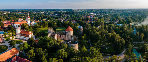 Aerial view of beautiful ruins of ancient Livonian castle in old town of Cesis, Latvia. Located within Gauja national park - obrazy, fototapety, plakaty