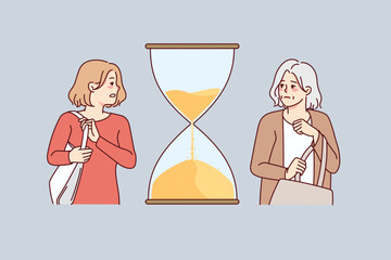 Young and old woman with hourglass between them. Concept of fast life and aging. Female life cycle. Vector illustration. 