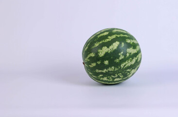 green watermelon on white background in studio. High quality photo