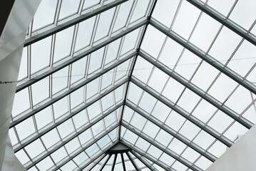 Glass roof construction with metal structure indoors