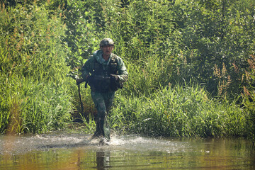 Full military experience - One day commando - running through the water with automatic rifle replica