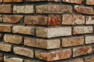 Corner of a brick building. Close-up. Background, texture for design.