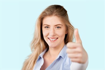 Young smiling fun happy woman showing thumb up like gesture. People lifestyle concept