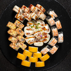 tasty sushi on the black background