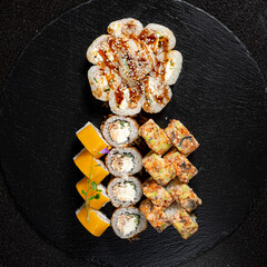 tasty sushi on the black background