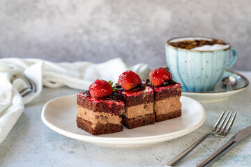 Strawberry tartlet. Small strawberry cake in a plate. On stone floor. close up