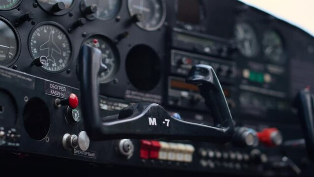 Modern airplane steering wheel inside small private aircraft cockpit close up.