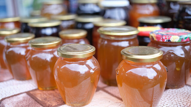 Lot of homemade apple juice in jars closeup