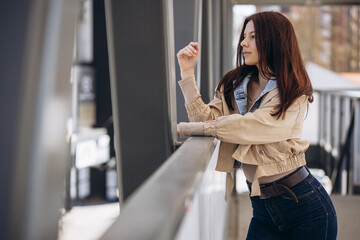 Young woman in casual wear posing in the street