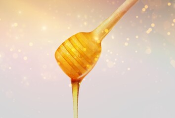 Golden honey flows from the stick. Aromatic nectar