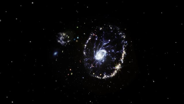 Fly towards Cartwheel Galaxy in the constellation of Sculptor. Zooming into the Cartwheel Galaxy.