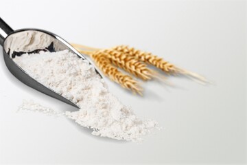 Wheat grain in scoop and bundle of wheat spikes. Concept of food supply, vegetarian diet, carbs and...