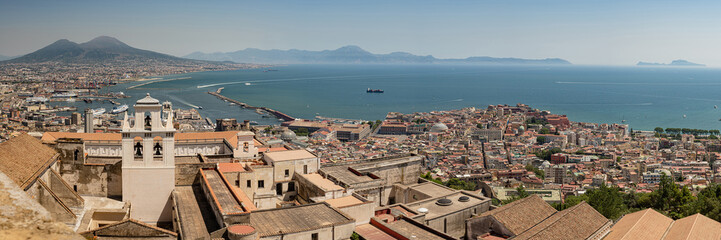 Naklejka na ściany i meble Amazing landscape on the terracotta roofs of Naples from the fortress of Sant Elmo. A charming observation deck with history. Panorama of the city.