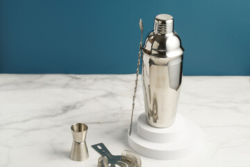 Bartender equipment - stainless steel silver colored cocktail shaker, hawthorne strainer, pourers,...