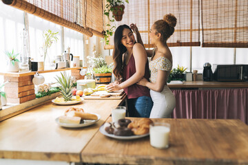 women lesbians cooking breakfast lgbt multiracial - obrazy, fototapety, plakaty