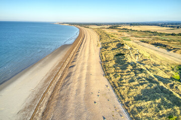 Aerial photo over the sand dunes that protect the Littlehampton links golf course from the sea.