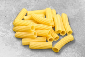 Penne pasta. Raw italian pasta on background,