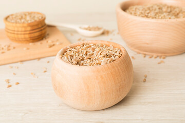 Bowls with wholegrain spelt farro on wooden table