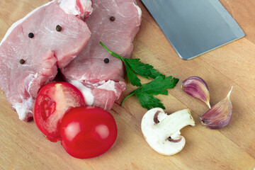 Raw meat. Fresh meat ready to cook with Ingredient - garlic, tomato, spice, pepper, champignon. Cooking concept.