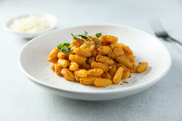 Homemade pasta with red pesto