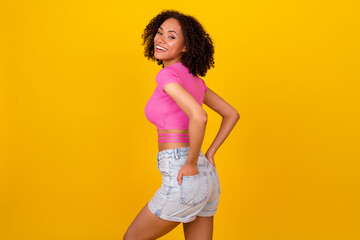 Fototapeta Profile photo of funny brunette young lady wear pink t-shirt shorts isolated on vivid orange color background obraz