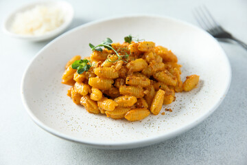 Homemade pasta with red pesto