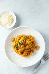 Homemade pasta with red pesto