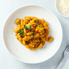 Homemade pasta with red pesto