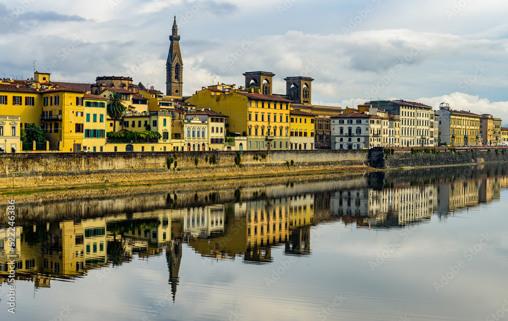 Wall mural The Florence riverbank of Arno river with the Florence National Central Library.