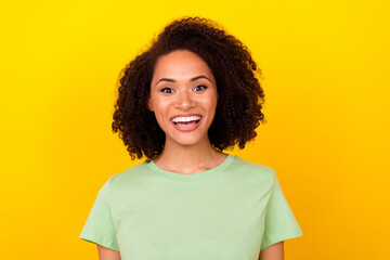 Photo of impressed brunette millennial lady wear green t-shirt isolated on bright yellow color background