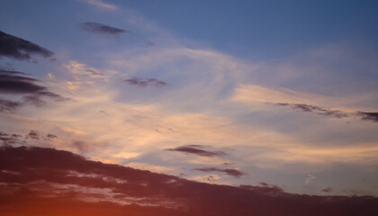 Morning glow illuminates the clouds on a beautiful colorful sky