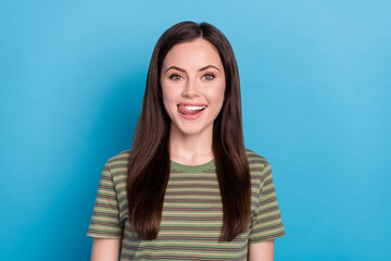 Photo of nice young brunette lady lick wear green t-shirt isolated on blue color background