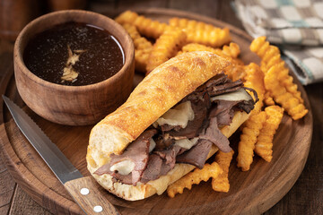 French dip sandwich and bowl of au jus - 522250723