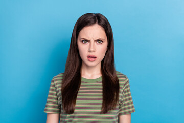 Fototapeta premium Photo of sad millennial brunette lady wear green t-shirt isolated on blue color background