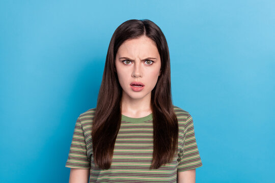 Photo of sad millennial brunette lady wear green t-shirt isolated on blue color background