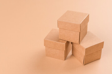 Paper boxes for storaging or transportation over light brown background with copy space....