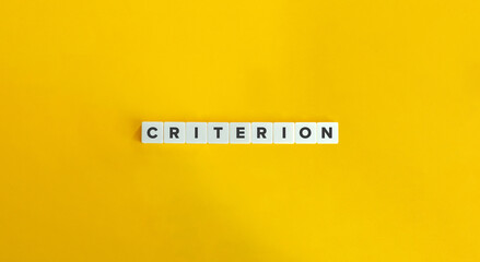 Criterion Word. Letter Tiles on Yellow Background. Minimal Aesthetics.