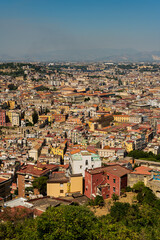 Fototapeta na wymiar Amazing landscape on the terracotta roofs of Naples from the fortress of Sant Elmo. A charming observation deck with history. Panorama of the city.