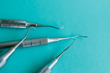 Close-up of dental scalers on blue background