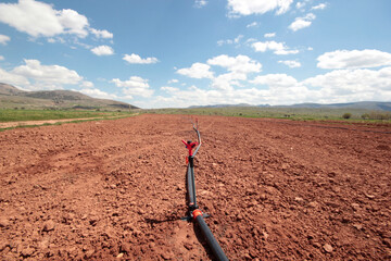 Fototapeta na wymiar Irrigation system, water saving irrigation system agricultural background