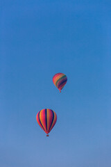 Two Hot Air Balloons against blue sky