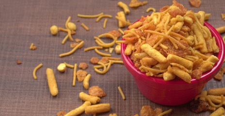 Indian Snacks, Traditional Indian deep fried salty dish called chivda or mixture or farsan made of gram flour and mixed with dry fruits and roasted nuts with salt, pepper, pulses, spice and green peas