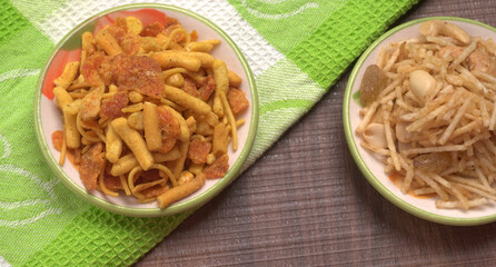Indian Snacks, Traditional Indian deep fried salty dish called chivda or mixture or farsan made of gram flour and mixed with dry fruits and roasted nuts with salt, pepper, pulses, spice and green peas