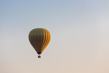 Colorful hot air balloon flying in the bright blue sky