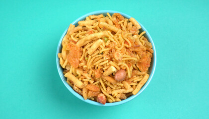 Indian Snacks, Traditional Indian deep fried salty dish called chivda or mixture or farsan made of gram flour and mixed with dry fruits and roasted nuts with salt, pepper, pulses, spice and green peas