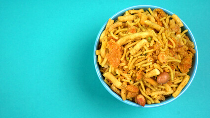 Indian Snacks, Traditional Indian deep fried salty dish called chivda or mixture or farsan made of gram flour and mixed with dry fruits and roasted nuts with salt, pepper, pulses, spice and green peas