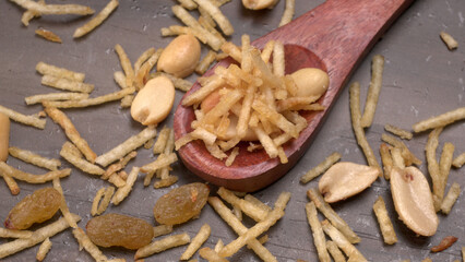 Indian Snacks, Traditional Indian deep fried salty dish called chivda or mixture or farsan made of gram flour and mixed with dry fruits and roasted nuts with salt, pepper, pulses, spice and green peas