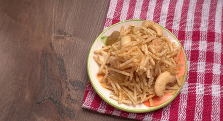 Indian Snacks, Traditional Indian deep fried salty dish called chivda or mixture or farsan made of gram flour and mixed with dry fruits and roasted nuts with salt, pepper, pulses, spice and green peas