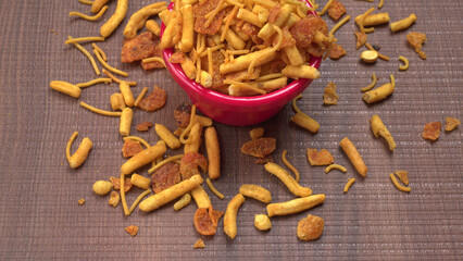 Indian Snacks, Traditional Indian deep fried salty dish called chivda or mixture or farsan made of gram flour and mixed with dry fruits and roasted nuts with salt, pepper, pulses, spice and green peas